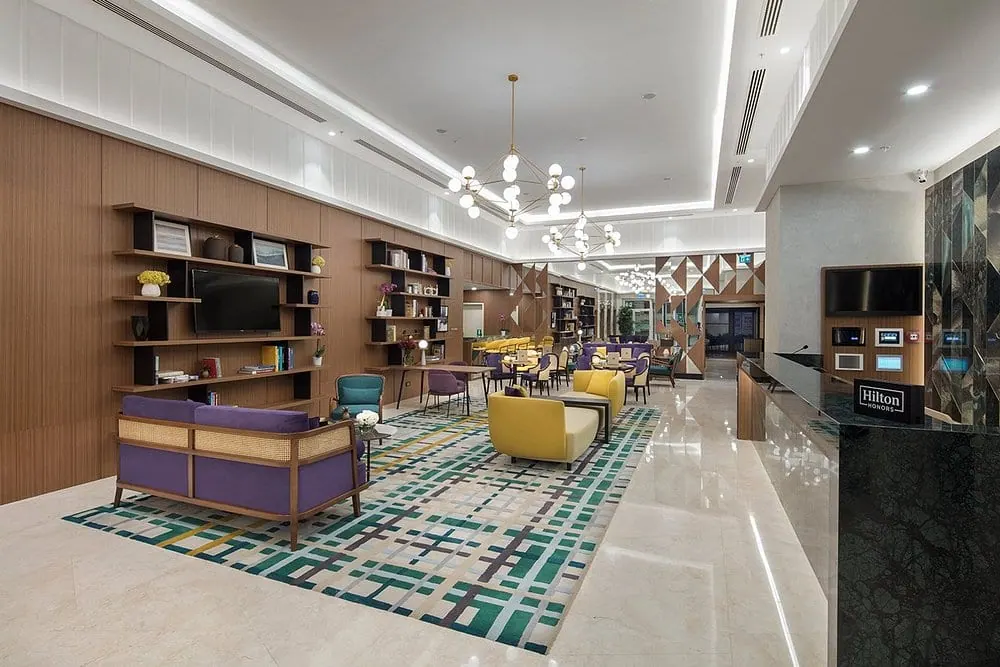 DoubleTree by Hilton Afyonkarahisar reception desk and stone-clad back wall